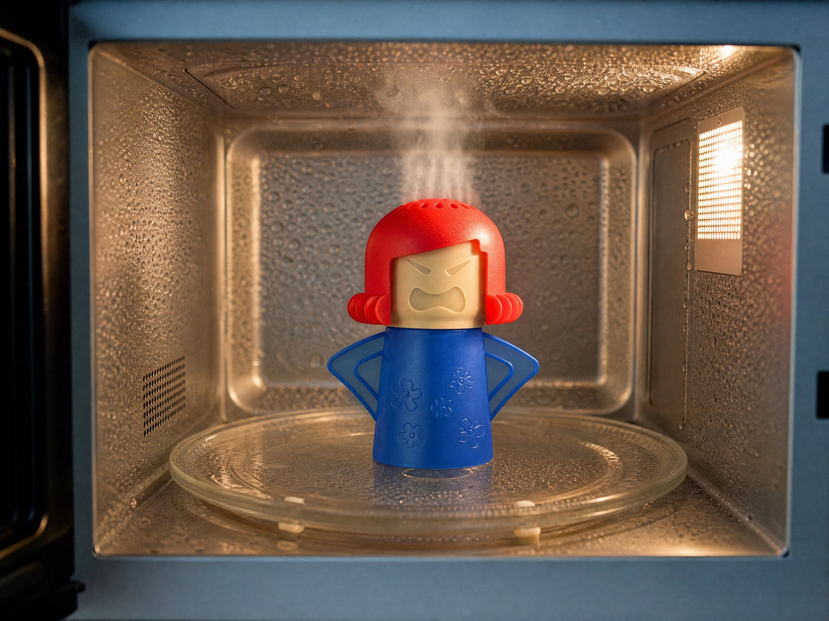 Steam rising from the cleaner inside a microwave, condensation on the cavity walls