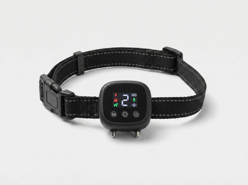 NooBark Anti-Bark Collar on a black strap with gray stitching, LED screen showing 2 above M, cycle and power buttons